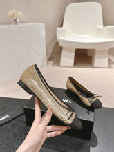 BALLET FLATS IN GOLDEN GLITTERED TULLE AND BLACK SATIN